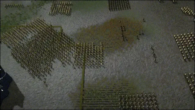 An overhead view of a battlefield filled with thousands of small animated soldiers in formations.